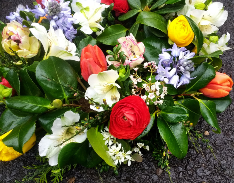 Bright Funeral Wreath copyright www.GallowayFlowers.co.uk