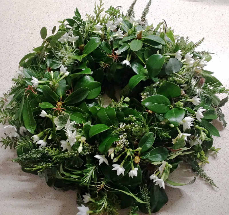Funeral Wreath Winter foliage & white flowers copyright www.GallowayFlowers.co.uk