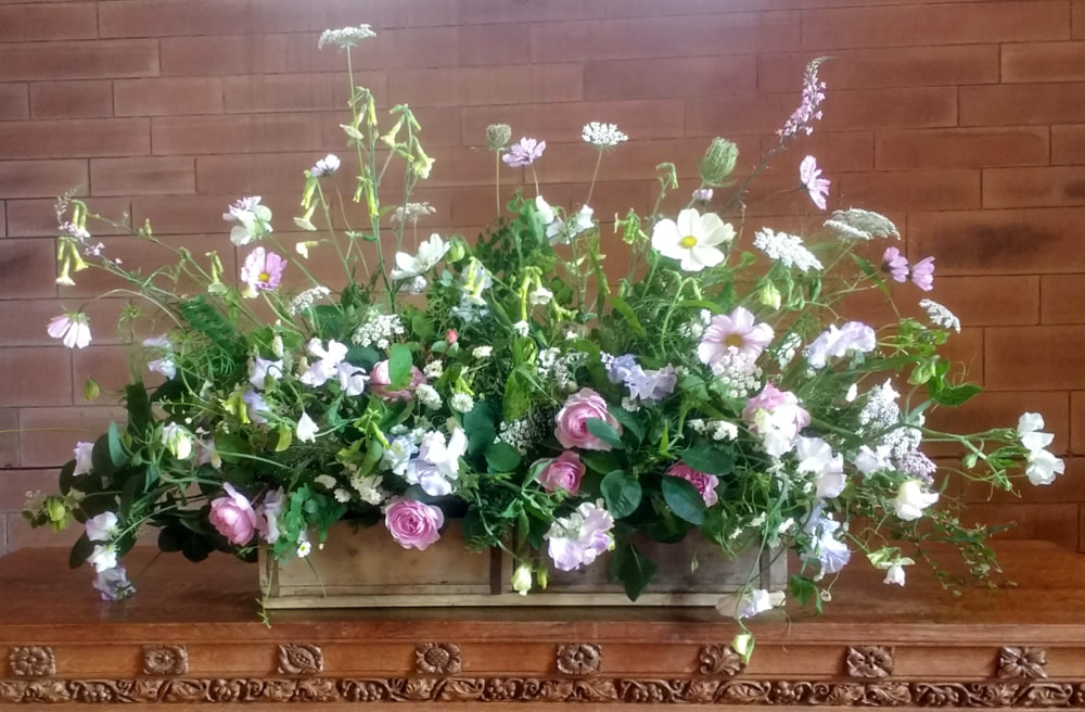 Country flowers in Church at Country wedding. Copyright www.GallowayFlowers.co.uk