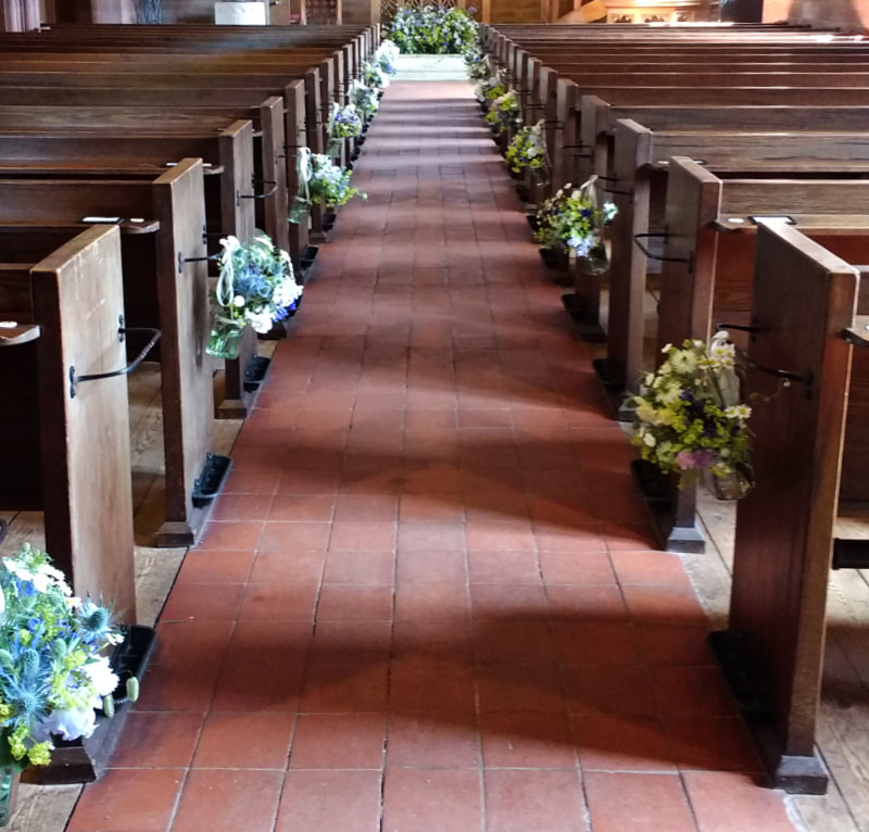 Pew Ends inCountry Church decorated with hanging jars filled with locally grown Summer flowers in blue & white. Copyright www.GallowayFlowers.co.uk