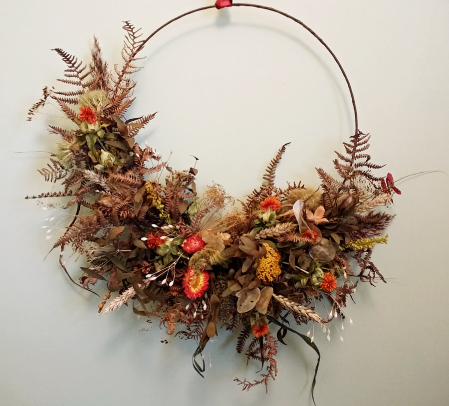 Hoop of dried flowers, grasses & seedheads in natural Autumn colours. Copyright www.GallowayFlowers.co.uk