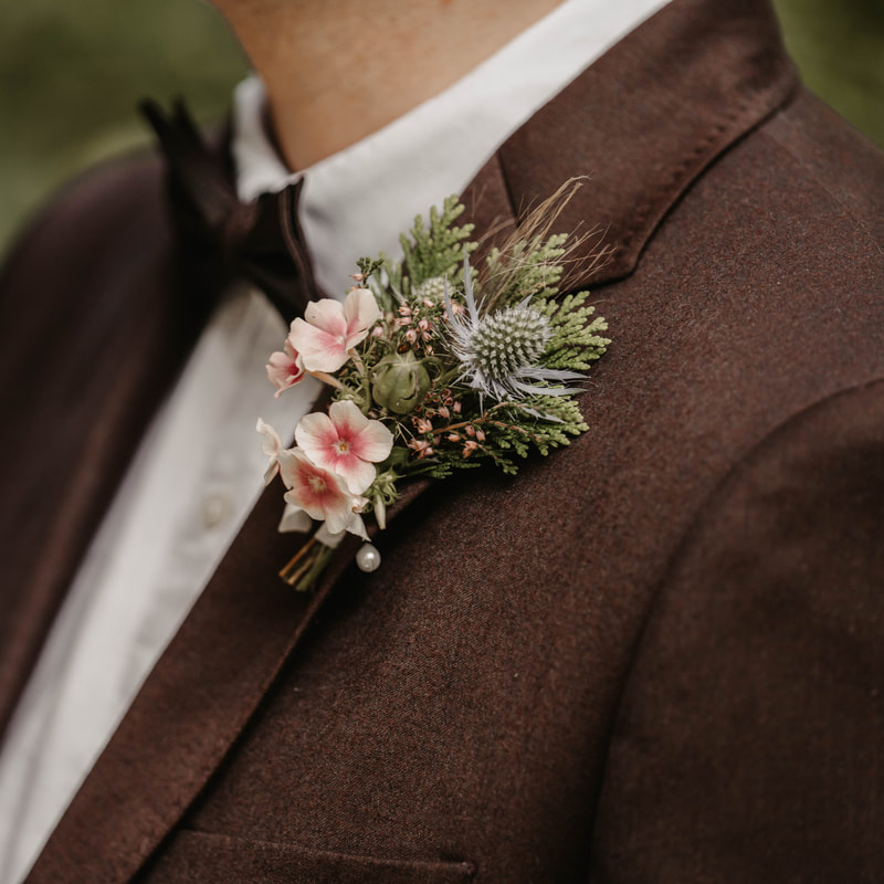 Grooms Buttonhole with Thistle & peach flowers by Galloway Flowers. Photo credit Willow & Wylde