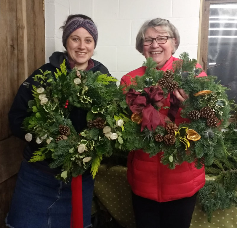 Happy wreathmakers after a Christmas workshop in Dumfries & Galloway, Scotland. Copyright www.GallowayFlowers.co.uk