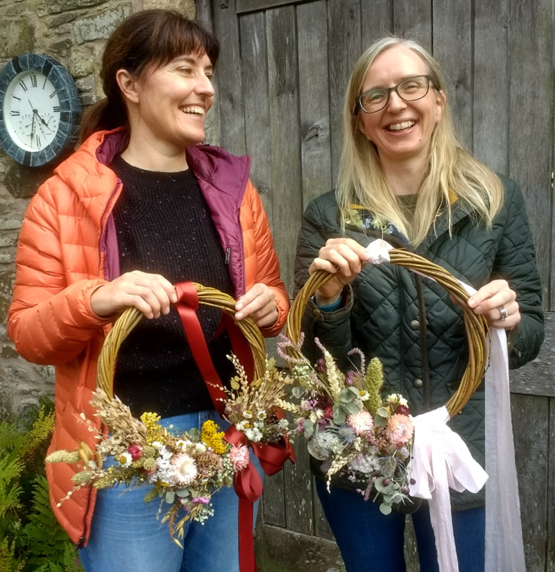 Smiling Crafters with completed Dried Flower Wreaths made at workshop in Scotland. Copyright www.GallowayFlowers.co.uk