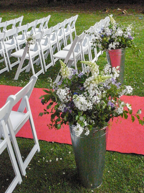 Venue flowers filled with locally grown seasonal flowers at a June wedding at Friars Carse hotel in Dumfries & Galloway